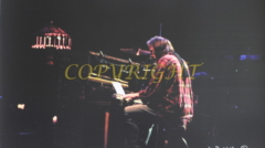 Photo of neil young at piano by james burkholder