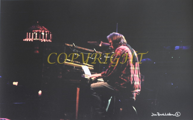 Photo of neil young at piano by james burkholder