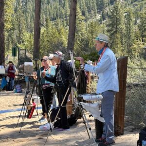 Artist Jim Burkholder is shown at the Lake Tahoe Sand Harbor PACE 25 paint out.