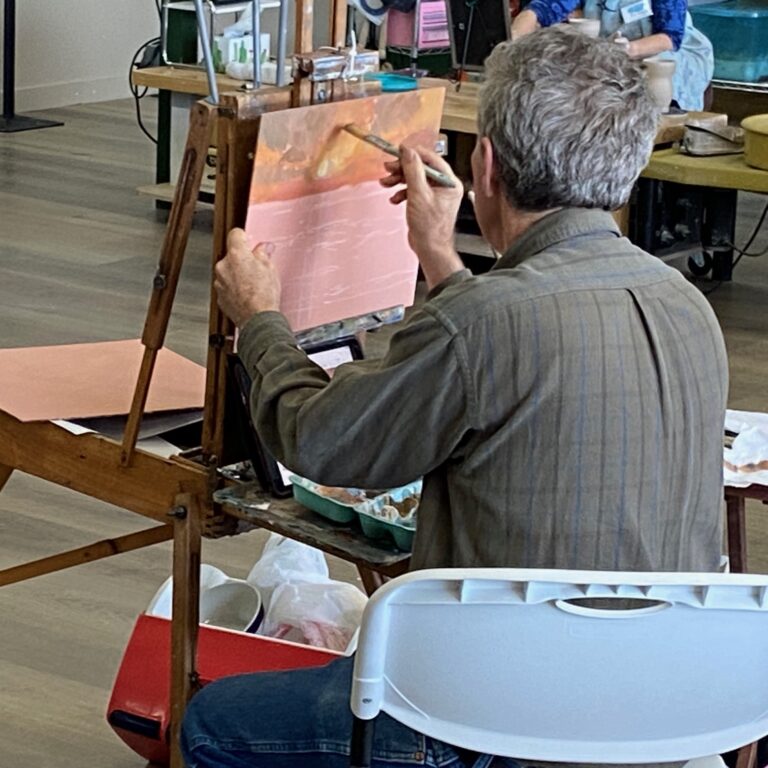 Guy Morrow, Artist, from Corpus Christi demonstrates a gulf sunrise painting at a workshop on South Padre Island attended by Jim Burkholder.
